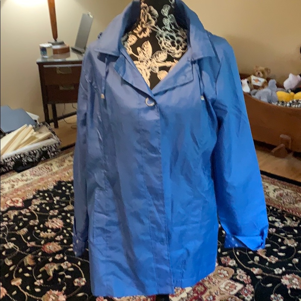 Sky blue raincoat with polkadot trim